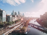city buildings near body of water during daytime