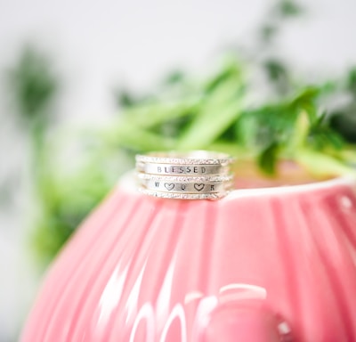 silver ring on pink lamp