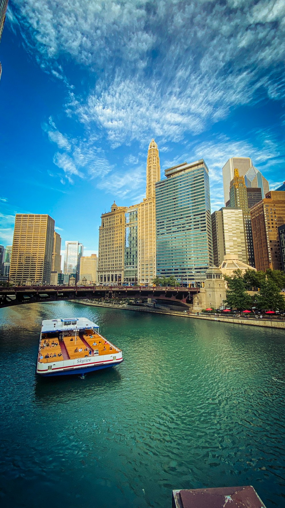 high rise buildings near body of water under blue sky during daytime