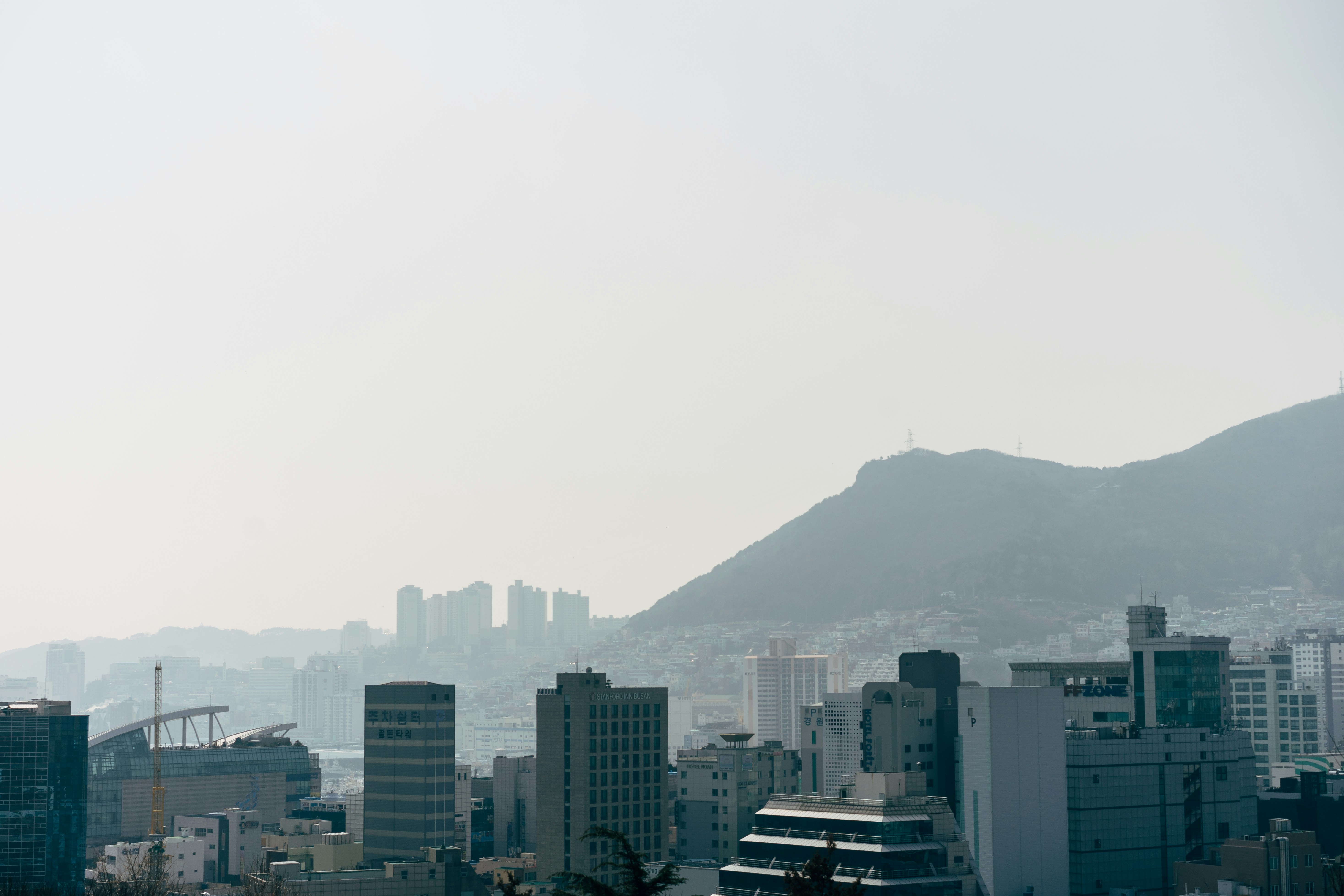 city skyline under white sky during daytime