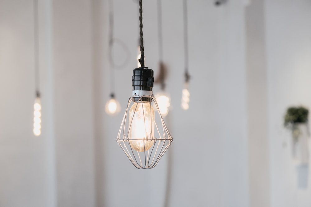 black pendant lamp turned on in room