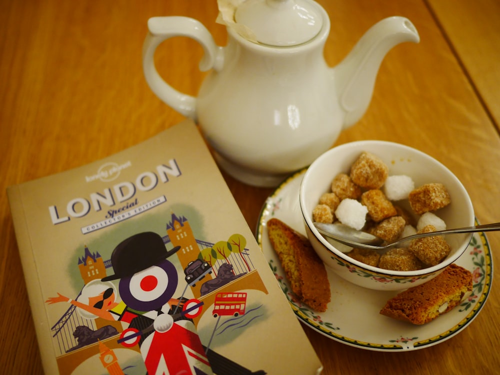 white ceramic teapot beside white ceramic bowl