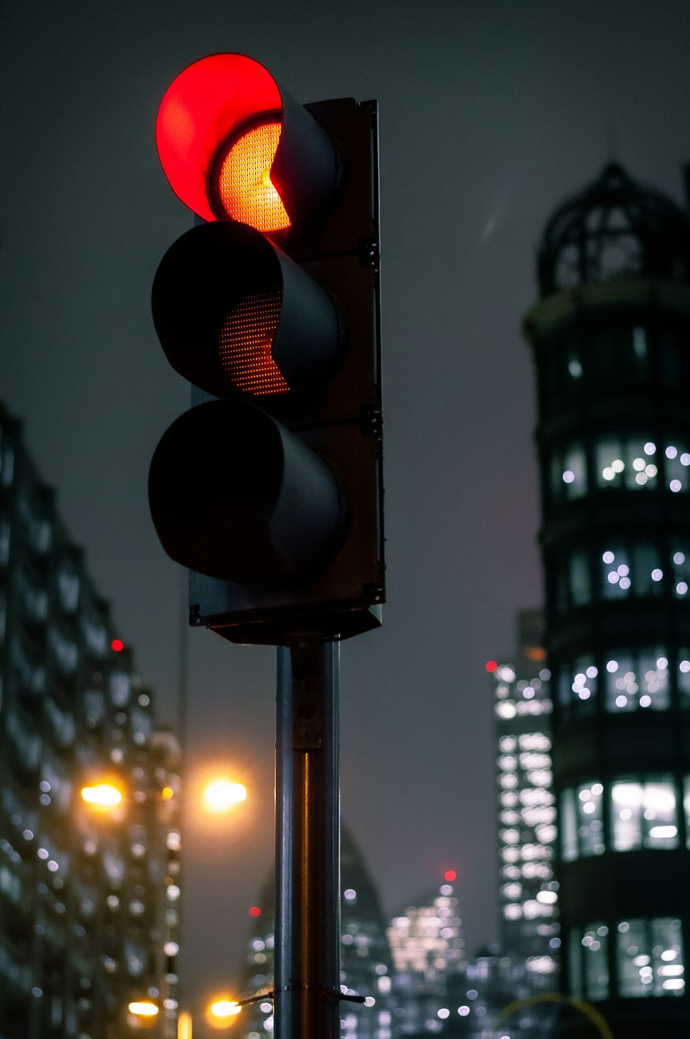 traffic light with red light during night time