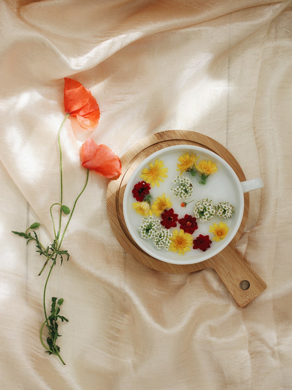 a bowl of food with flowers on a table