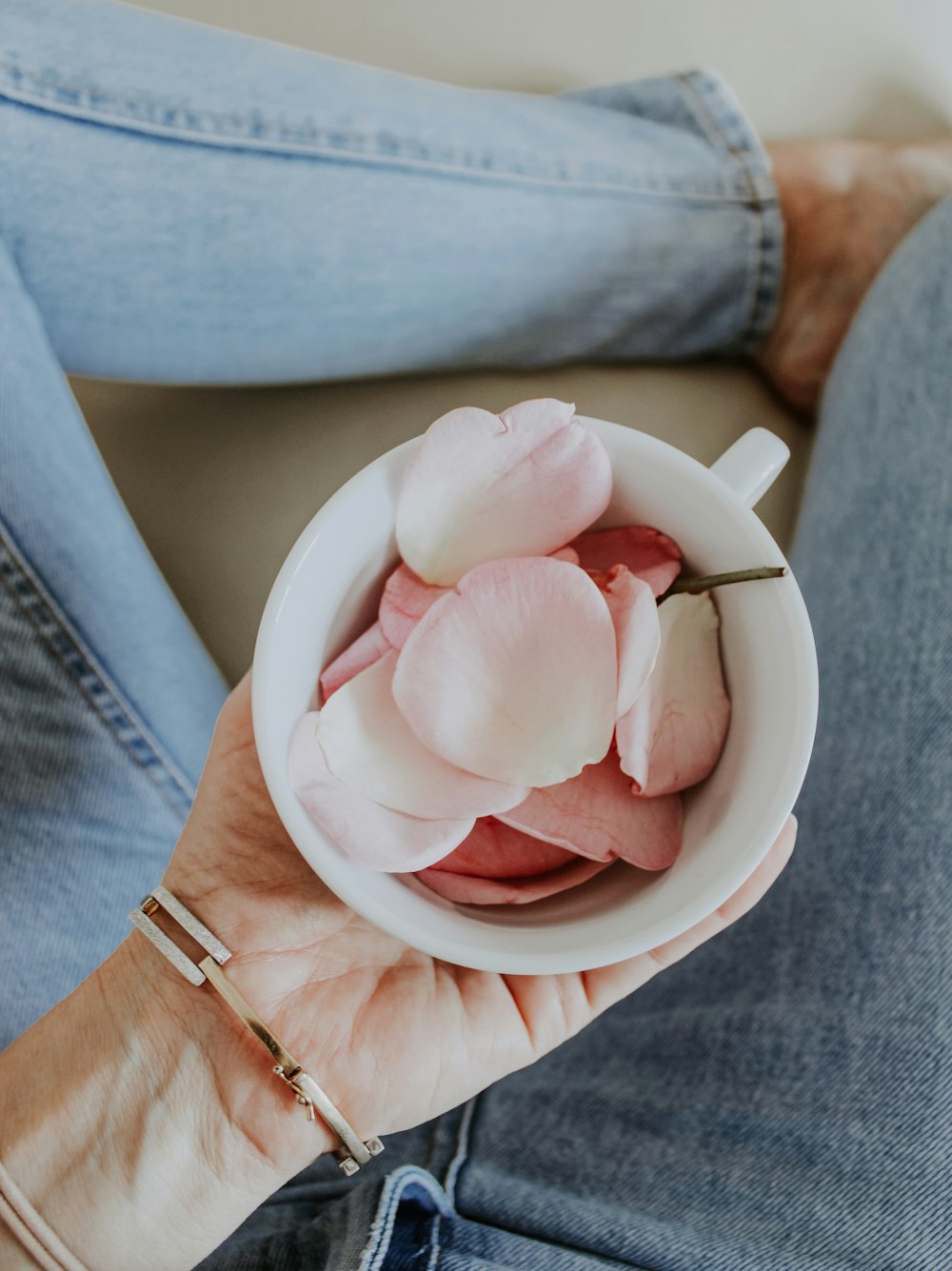 pink rose petals on white ceramic bowl