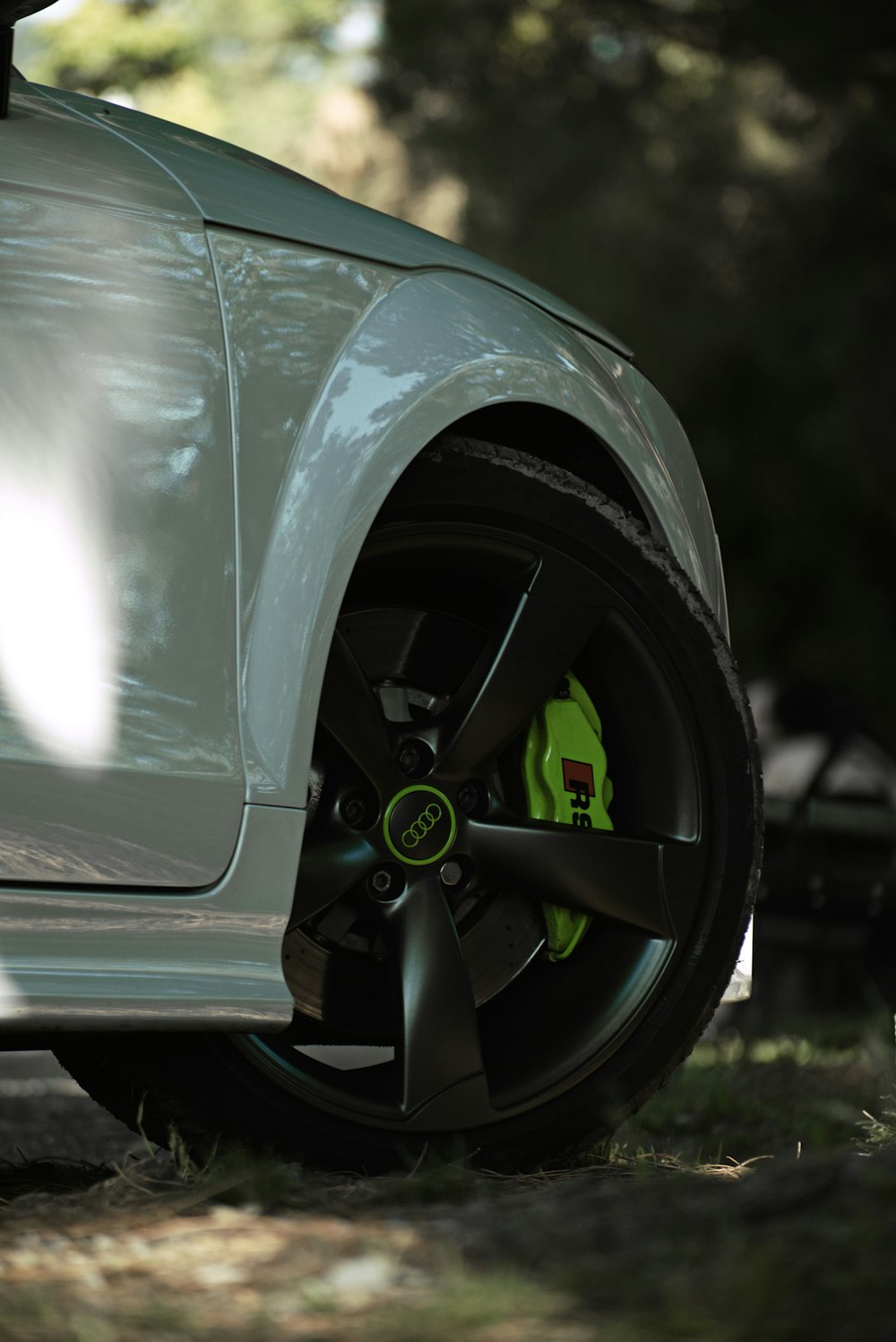 black car with green wheel