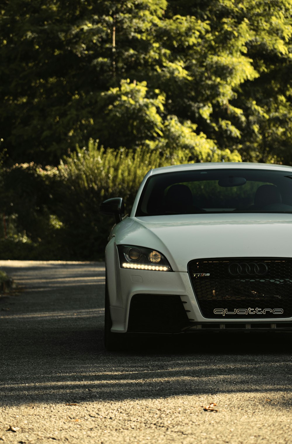 white audi a 4 on road during daytime