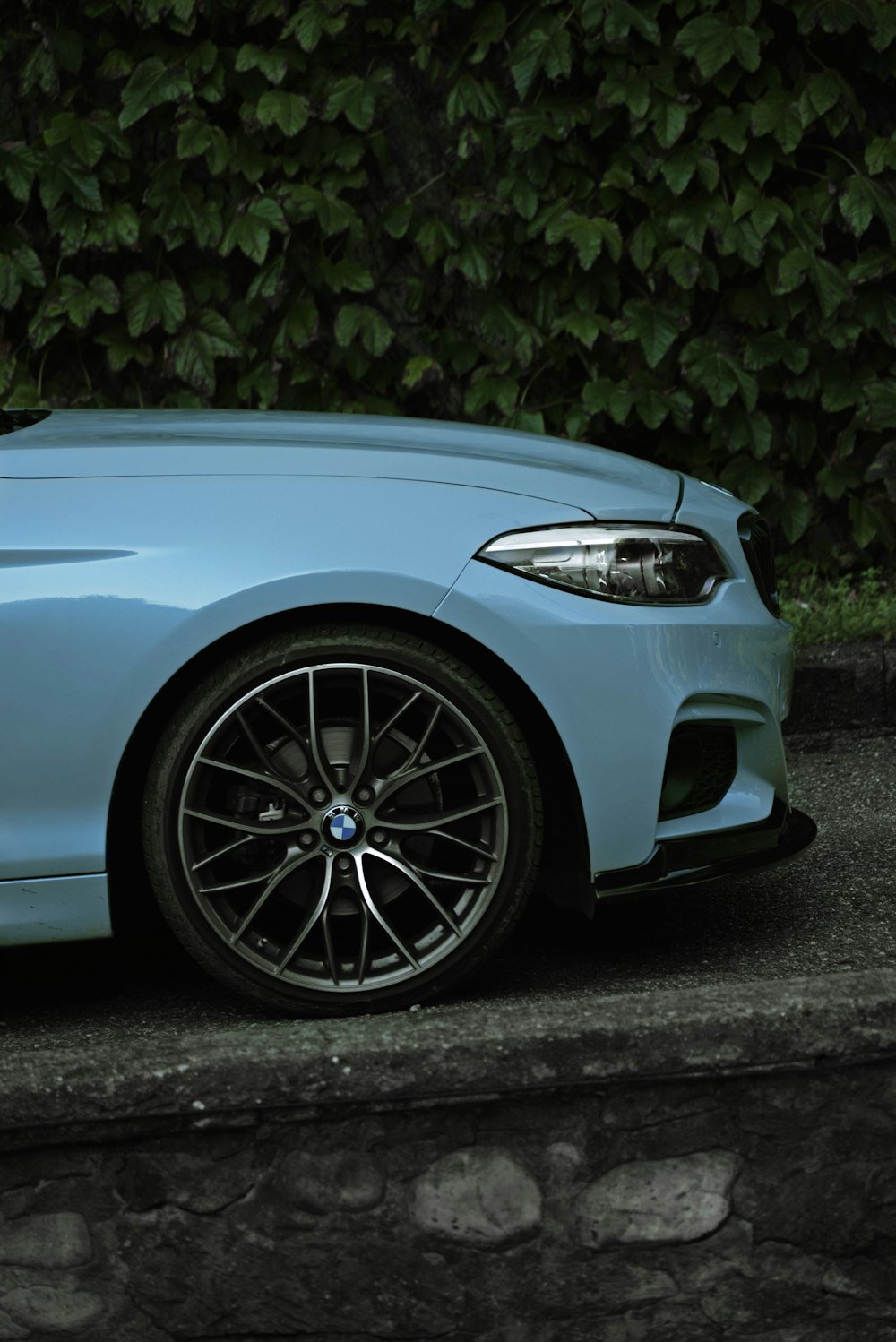 blue car with chrome wheel