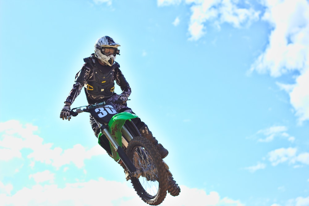 man riding motocross dirt bike