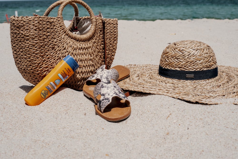 brown woven basket on white sand