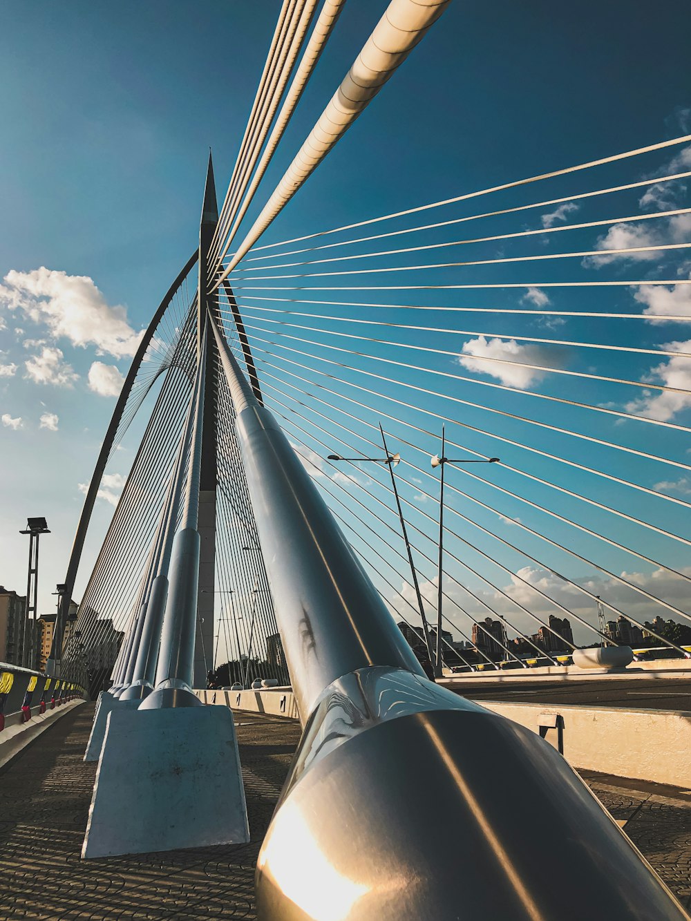 white metal bridge under blue sky during daytime