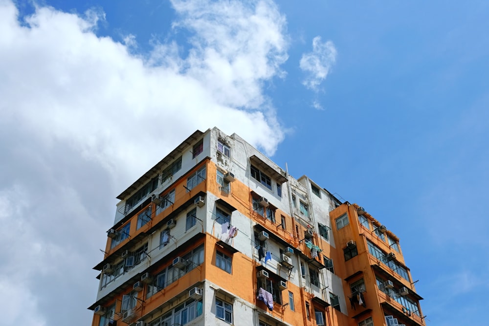 brown and white concrete building under blue sky during daytime