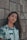woman in white blue and green floral shirt