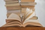 white book on brown wooden table