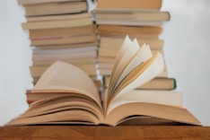 white book on brown wooden table