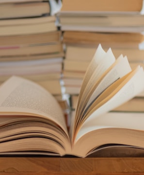 white book on brown wooden table