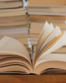 white book on brown wooden table