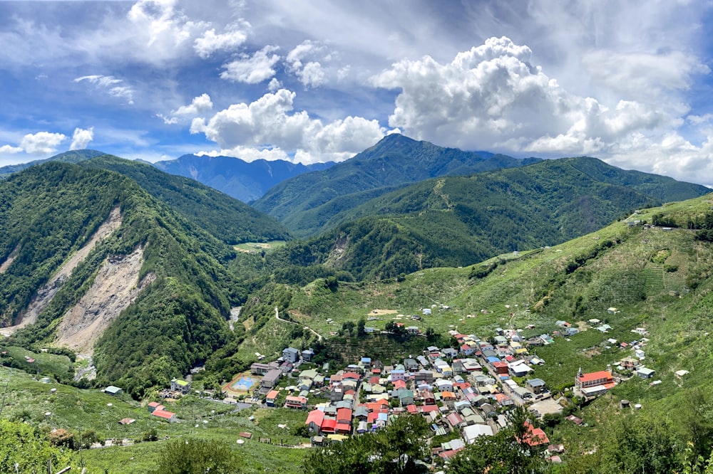 green mountains under white clouds and blue sky during daytime
