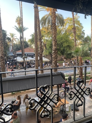 An inviting café terrace with people enjoying coffee.