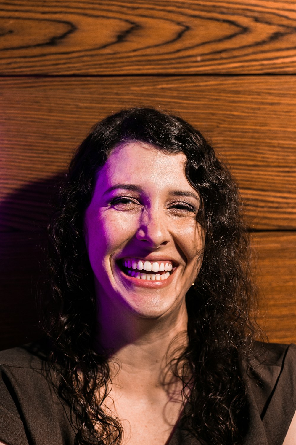 smiling woman in black shirt
