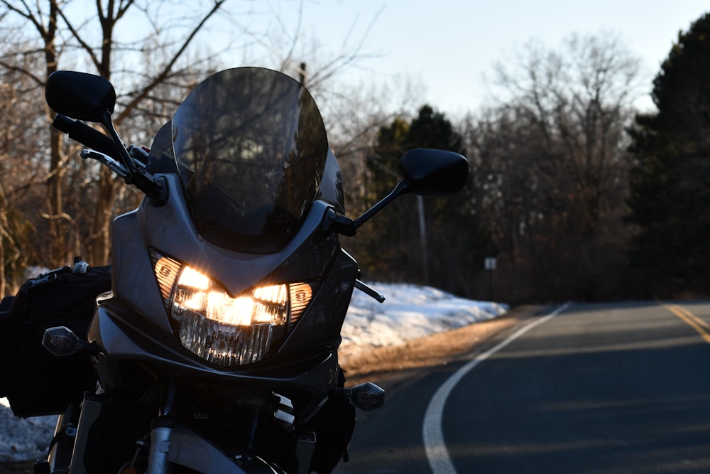 black motorcycle on road during daytime