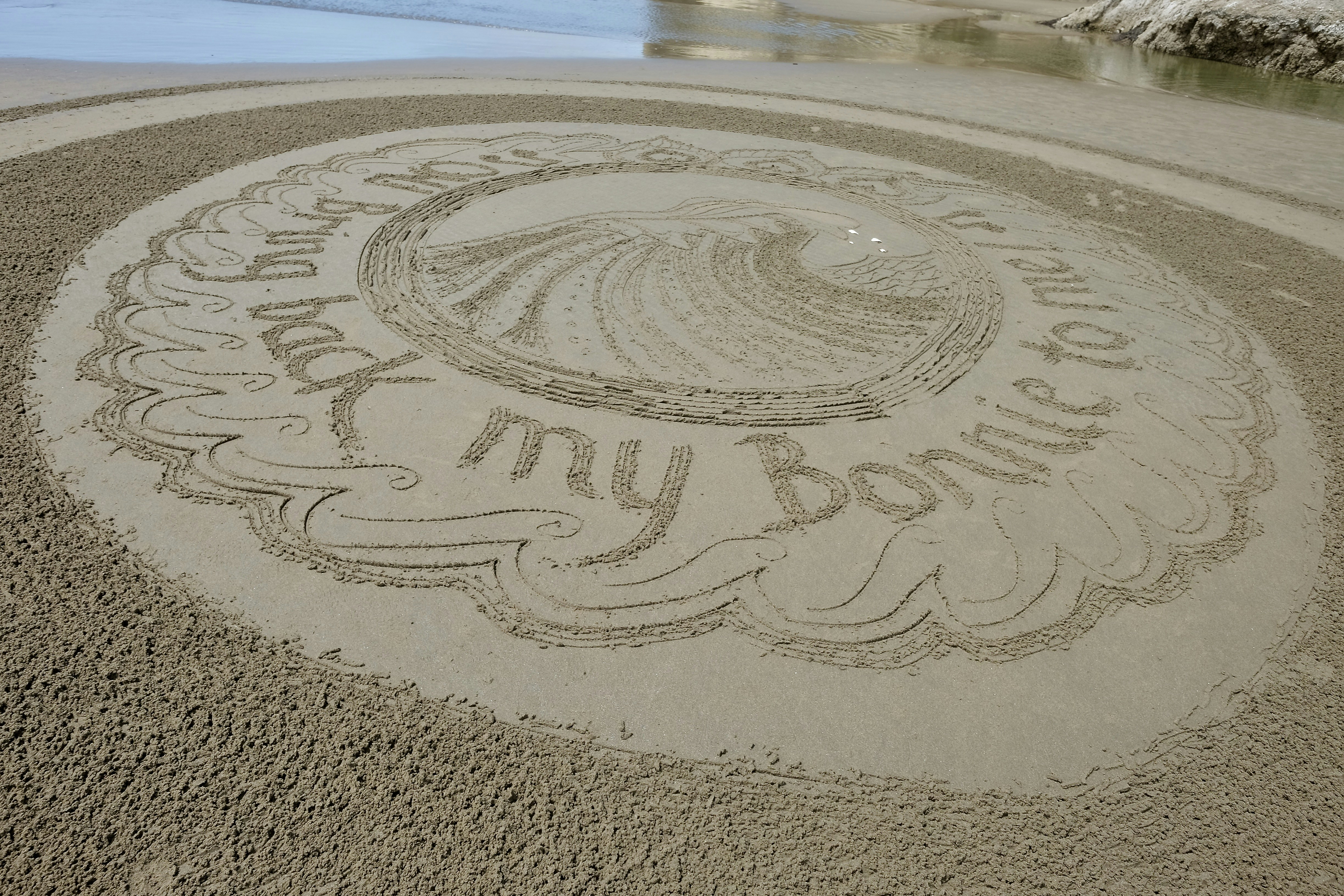 white round table on brown sand during daytime