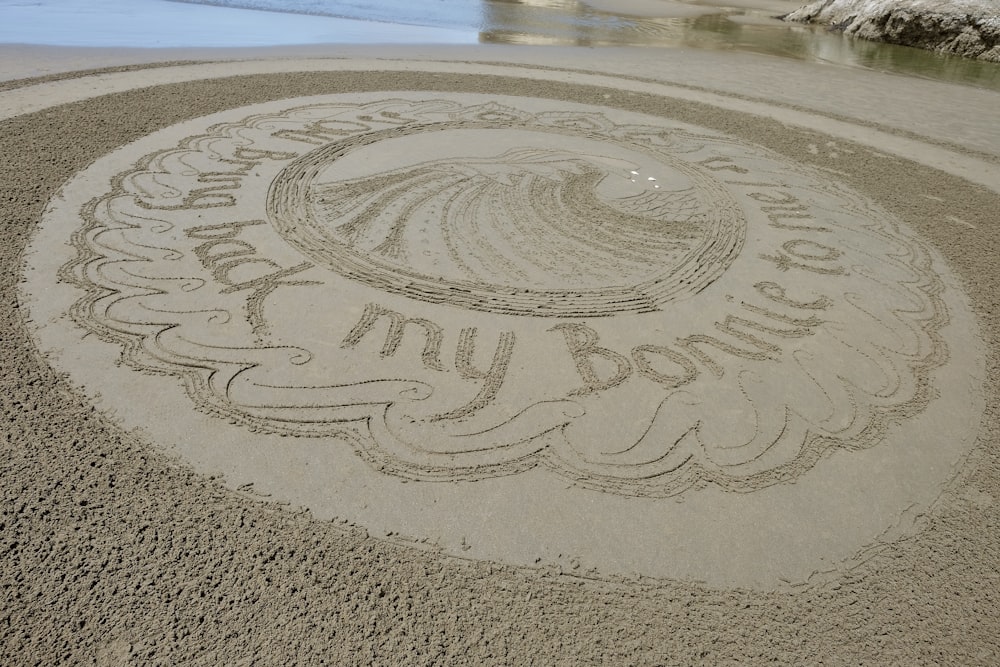 white round table on brown sand during daytime