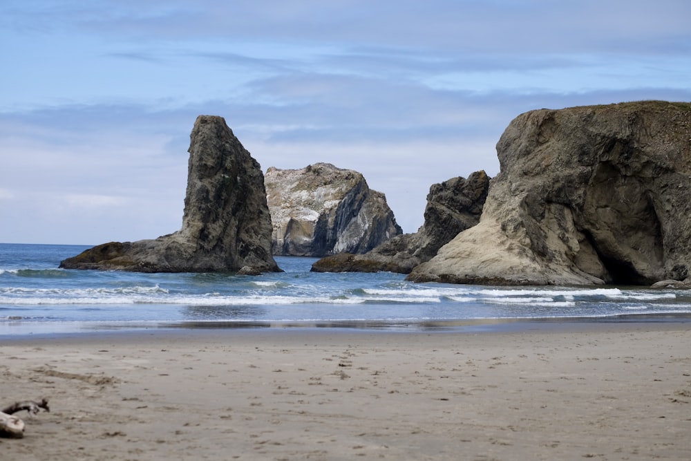 brown rock formation on sea shore during daytime