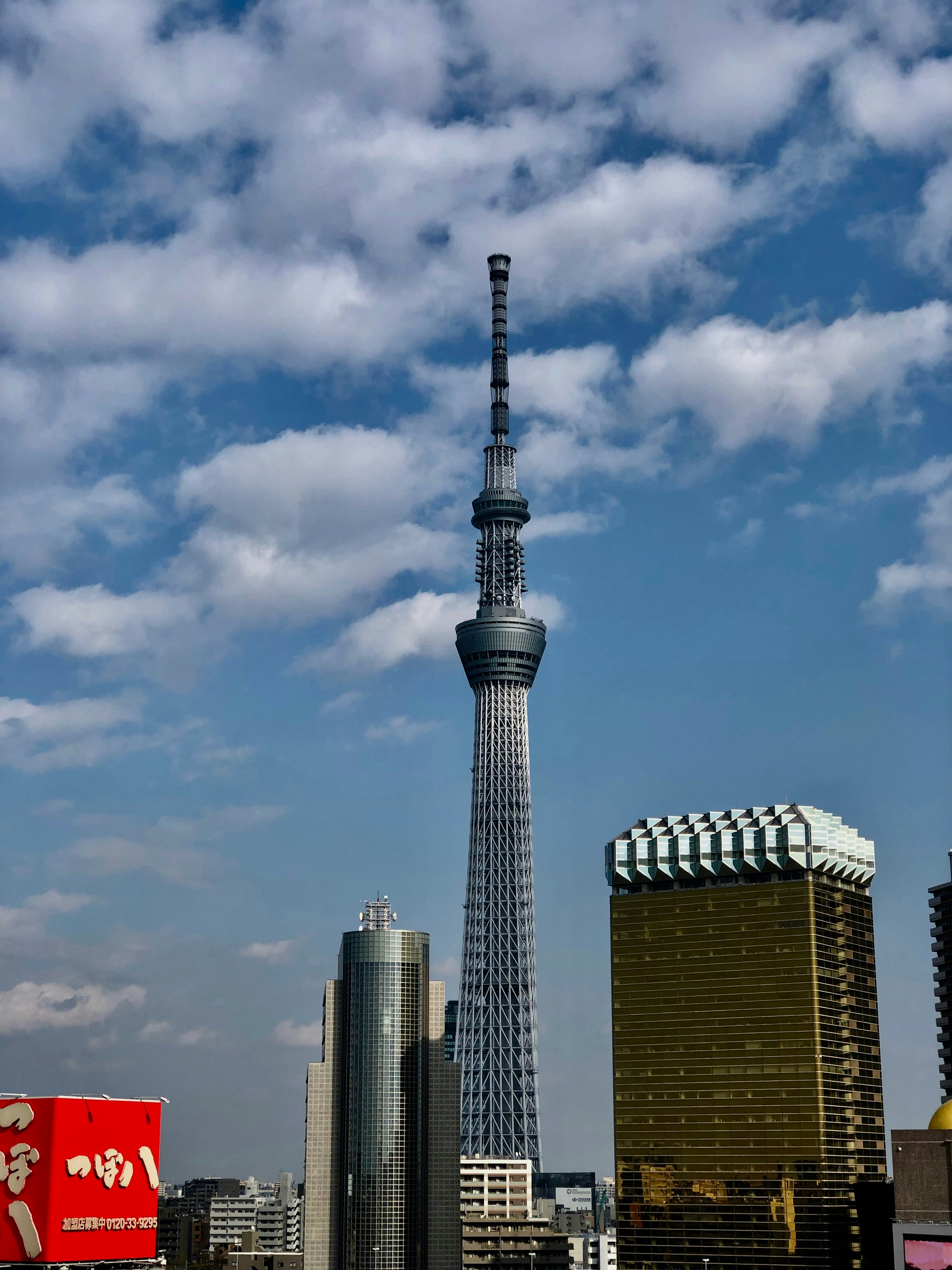 white and brown concrete tower under blue sky