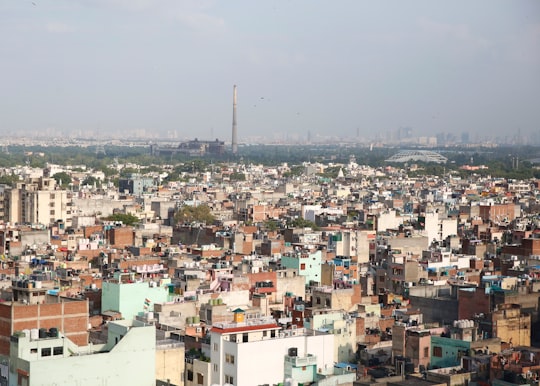 white and brown concrete buildings during daytime in New Delhi India