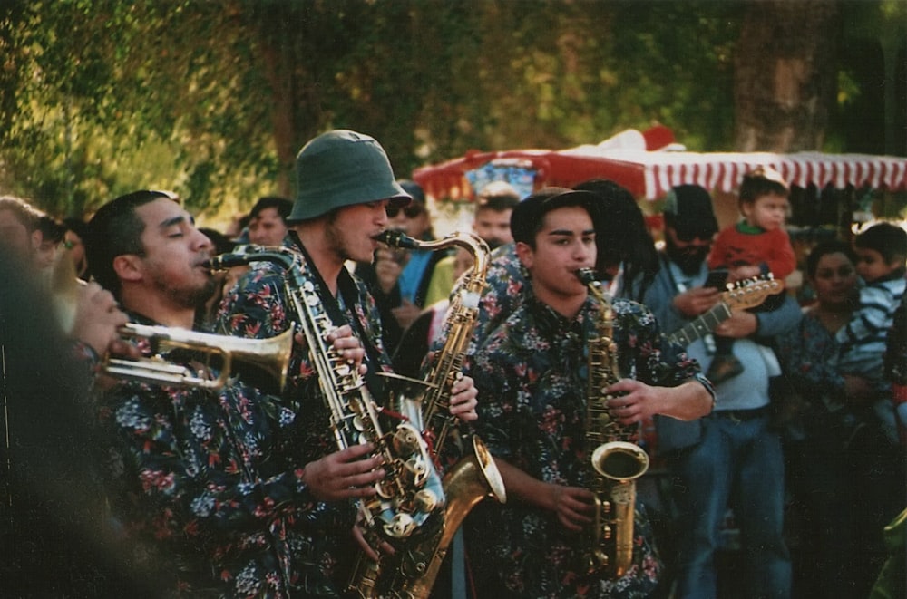 people playing musical instrument during daytime