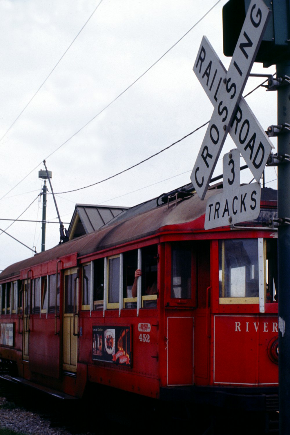red and black train under white clouds during daytime