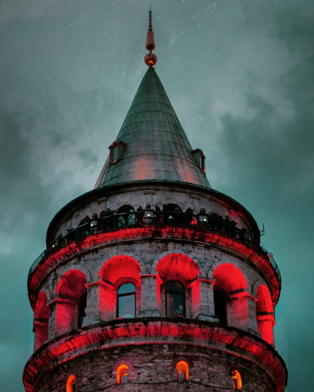 red and white concrete building under cloudy sky