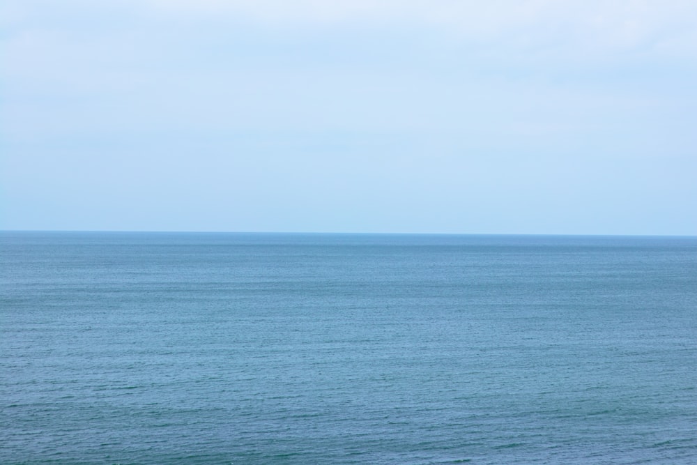 blue sea under white sky during daytime