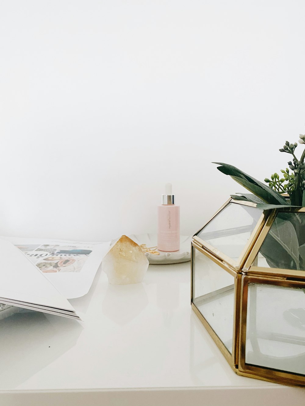 gold framed mirror on white table