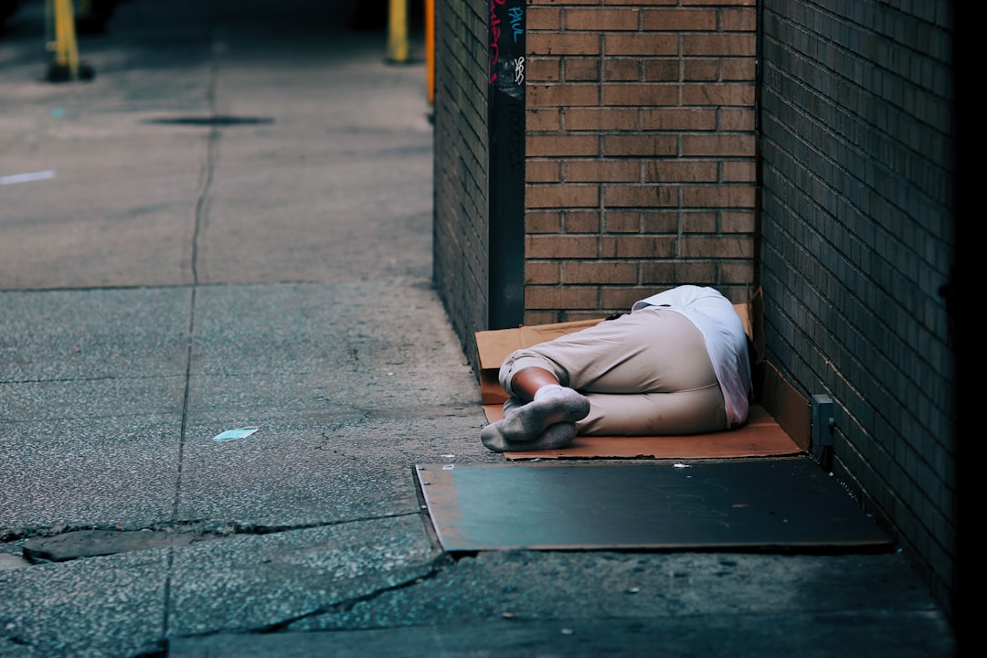 woman in white shirt lying on floor