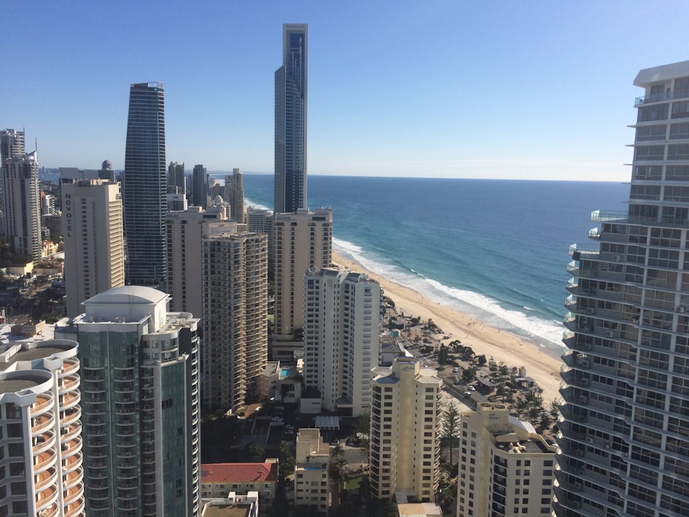 high rise buildings near sea during daytime