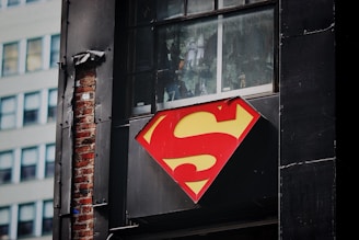 Superman sign on a door, symbolizing hidden strength and the power of reclaiming male sexual health.