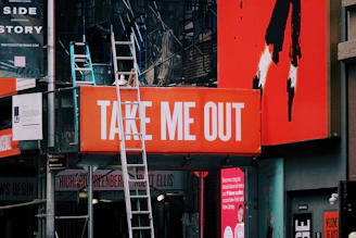 a sign that says take me out on a building