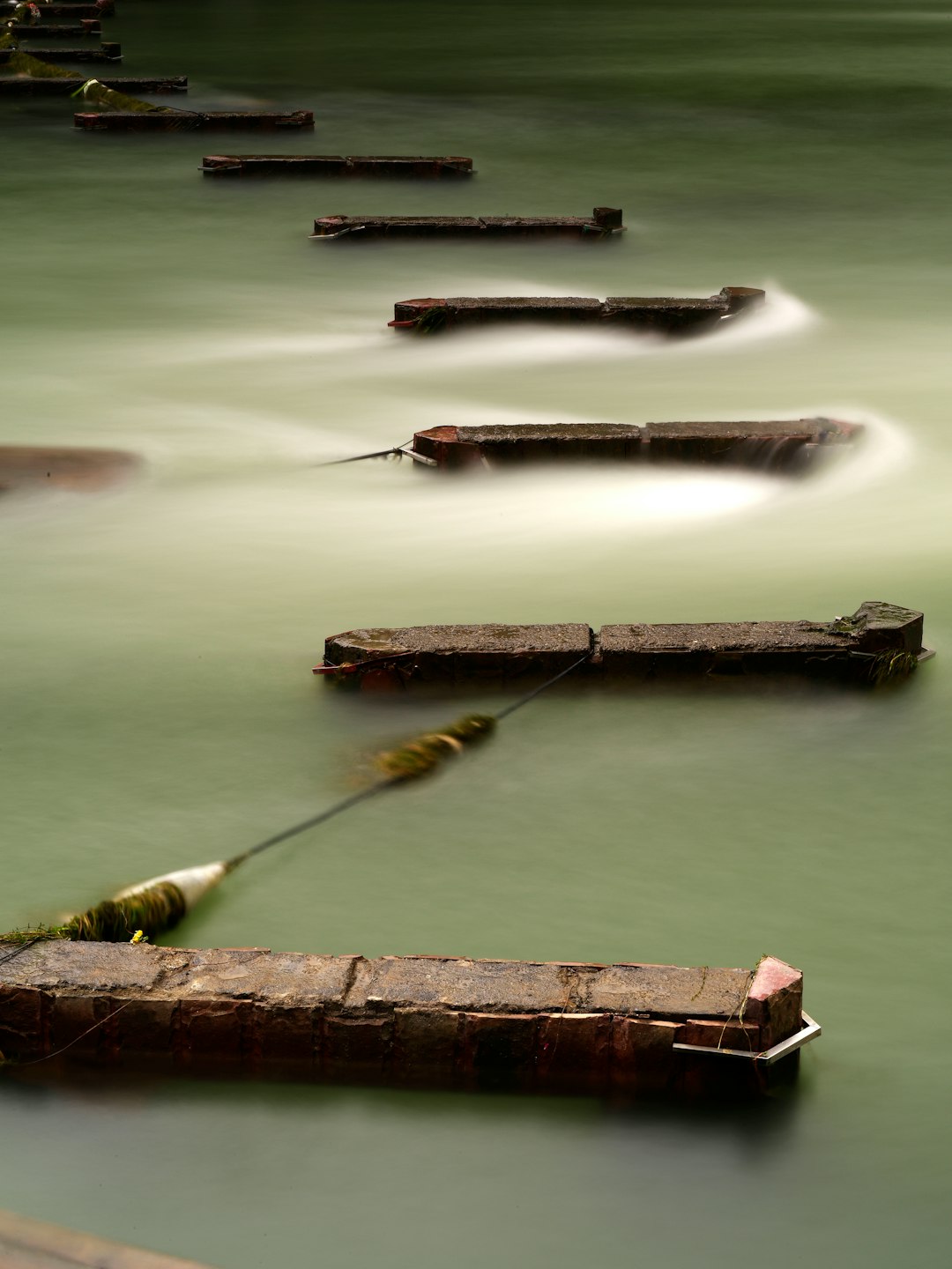 brown wooden dock on body of water during daytime