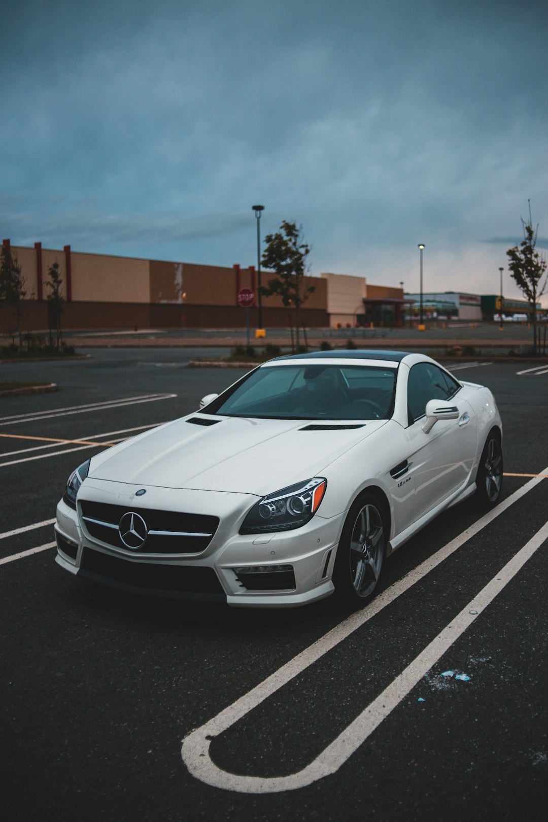 white bmw m 3 coupe parked on parking lot during daytime