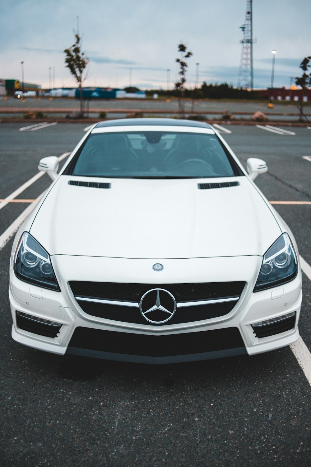 white mercedes benz car on road during daytime