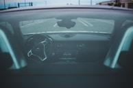 A 360-degree video still of a vehicle interior highlighting the dashboard and seats.
