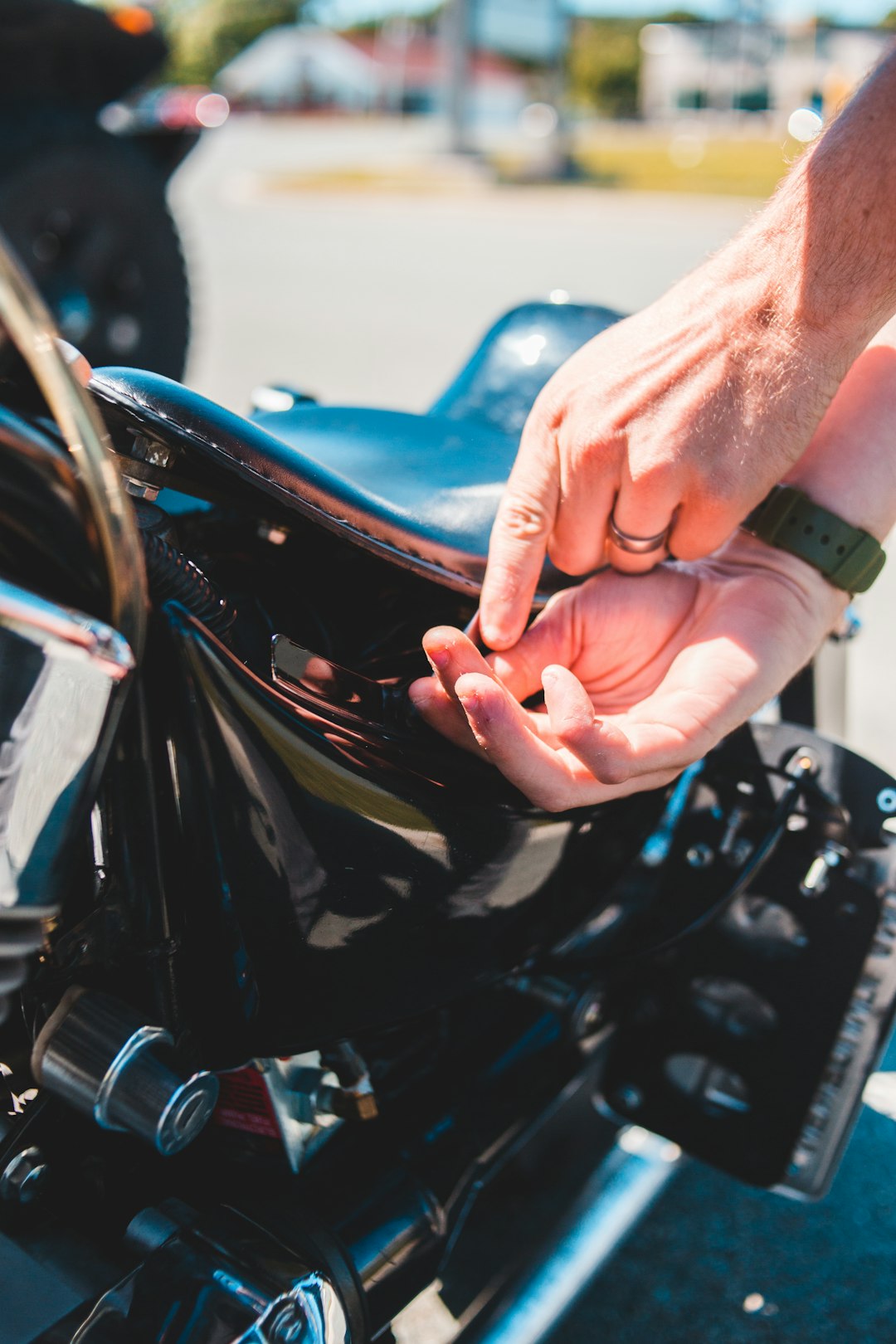 person holding black and blue motorcycle