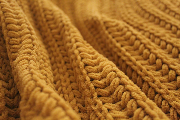 Macro de tejido de lana en tono marrón
