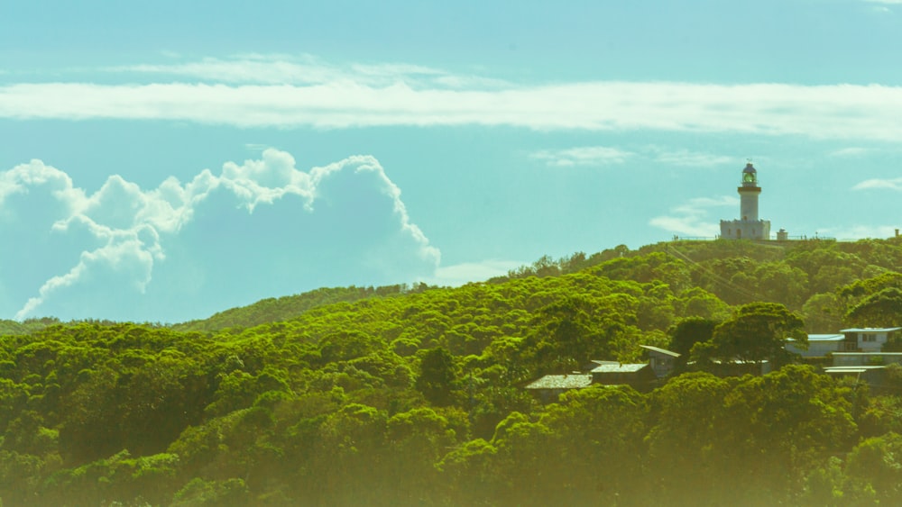 green mountain under white clouds and blue sky during daytime