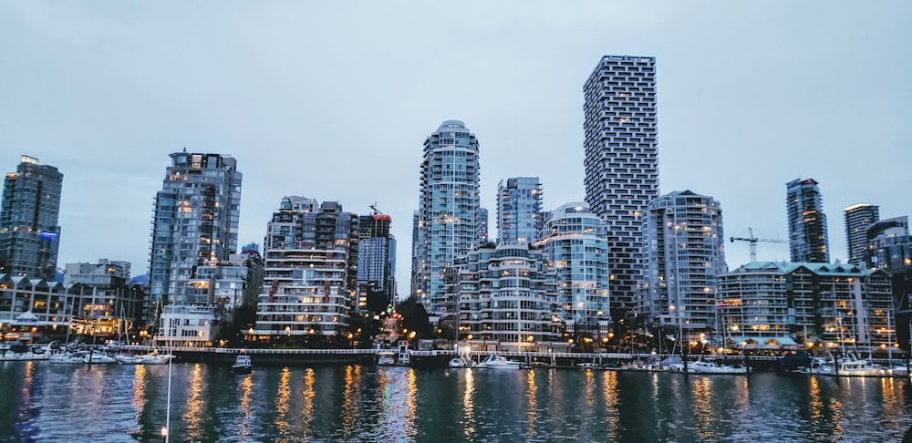 city skyline across body of water during daytime