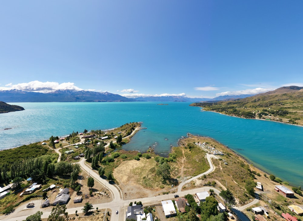 aerial view of white concrete building near blue sea during daytime