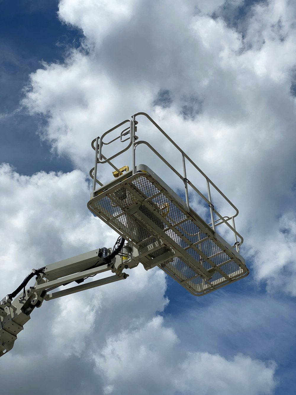 blue and silver shopping cart under blue and white cloudy sky during daytime