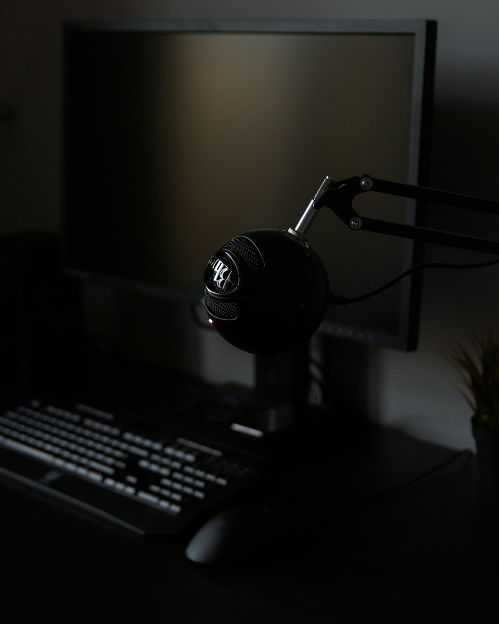 black and silver microphone on black table